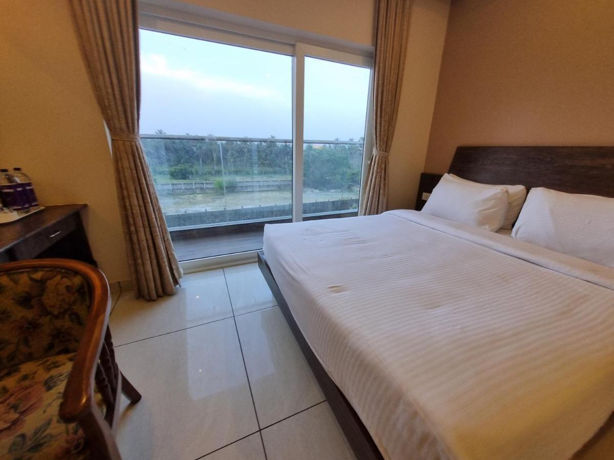 Отель Plutus Residency Ауровиль Экстерьер фото